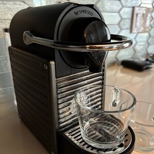Nespresso Black Coffee Machine with Silver Accents